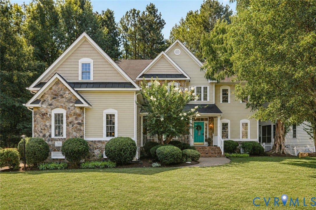 7618 Hampton Green Drive, Chesterfield, VA 23832 Elegant two-story residence featuring a stone and siding exterior with multiple gabled rooflines and architectural detail