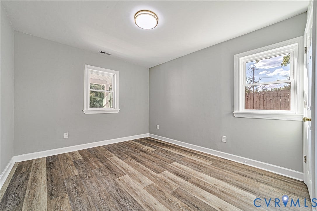 4502 Bunn Avenue, Fulton, Richmond, VA 23231 Room featuring wood-finish flooring, light gray wall paint, and white trim