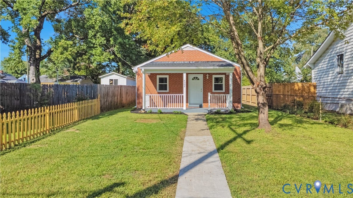 4502 Bunn Avenue, Fulton, Richmond, VA 23231 Brick exterior with a covered front porch featuring white railings