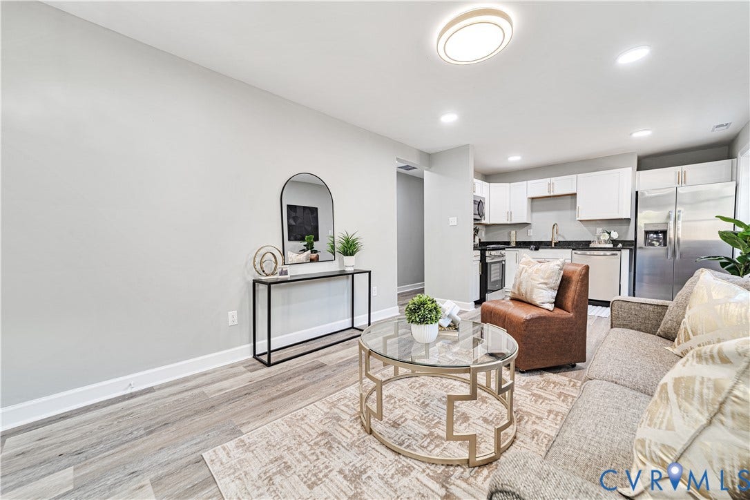 4502 Bunn Avenue, Fulton, Richmond, VA 23231 Open-concept living area with wood-finish flooring, recessed lighting, and a modern ceiling light fixture