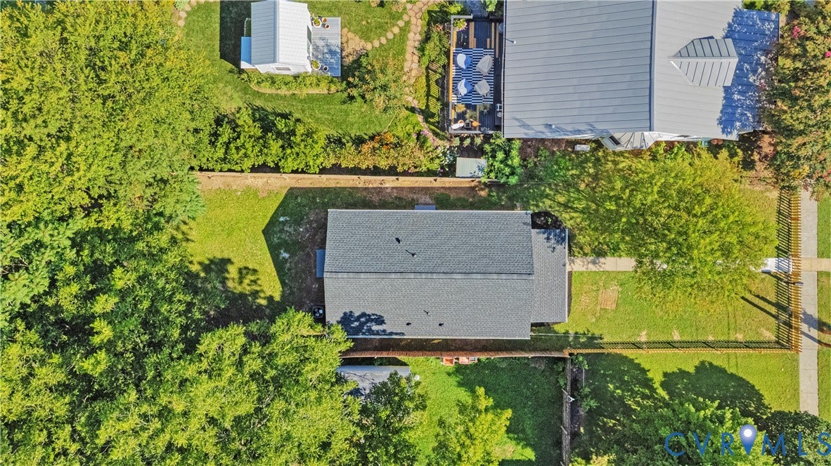 4502 Bunn Avenue, Fulton, Richmond, VA 23231 Overhead view of a residential property featuring a gray shingle roof, surrounded by mature trees and green lawns
