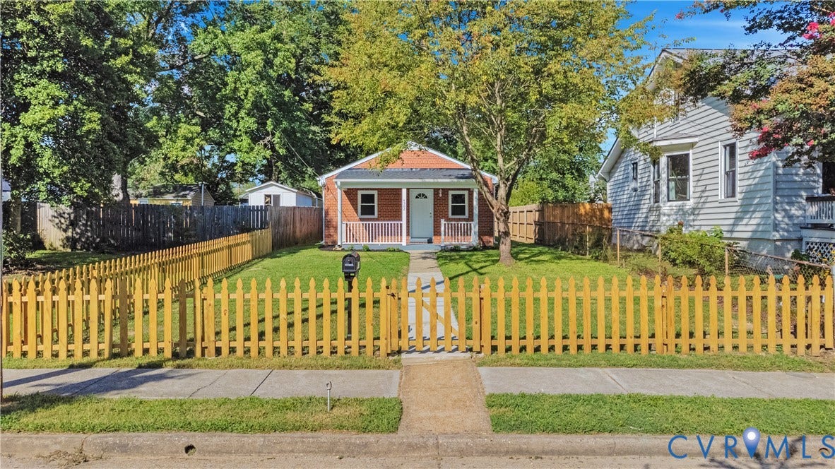 4502 Bunn Avenue, Fulton, Richmond, VA 23231 Brick exterior featuring a covered front porch with white columns