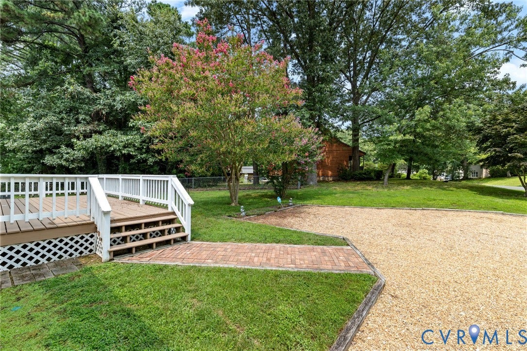 Rear deck with white railing and lattice skirting