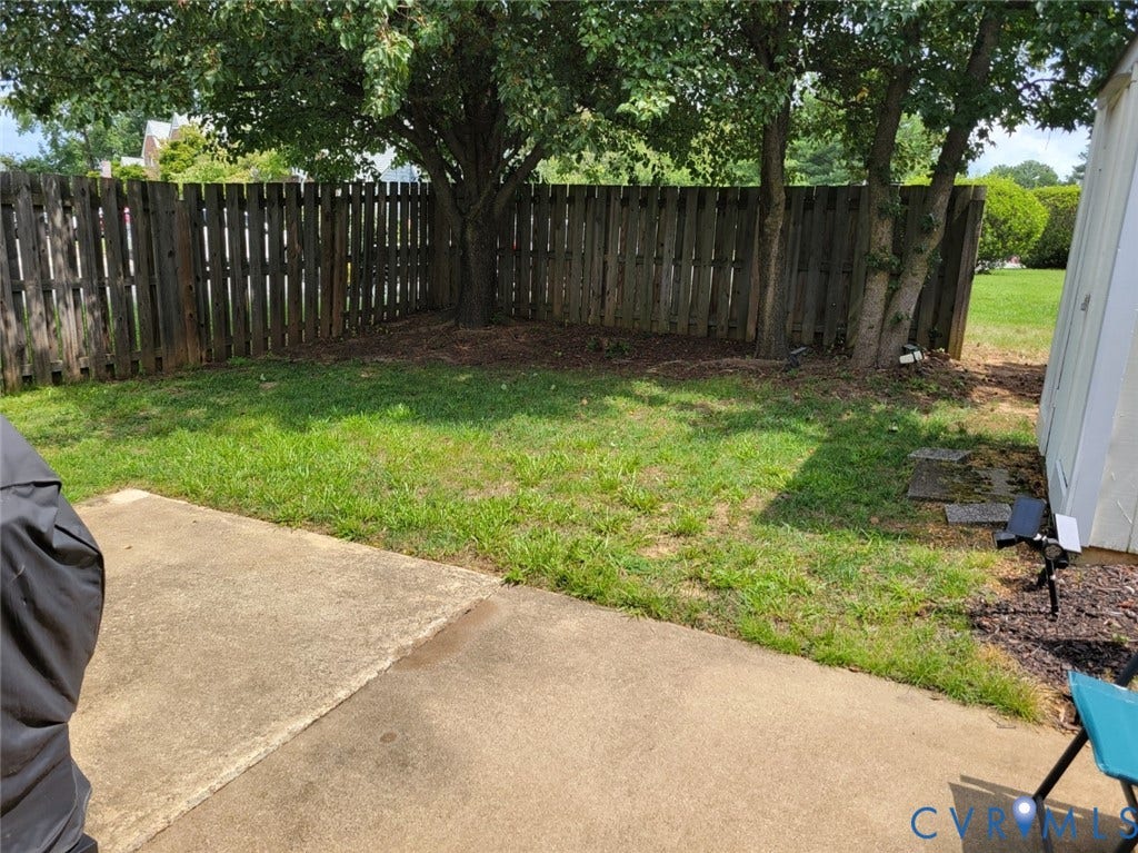 4900 Finnegan Court, Henrico, VA 23228 concrete patio with a full privacy fence