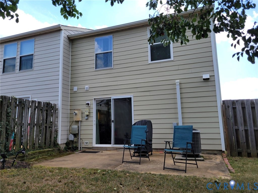 4900 Finnegan Court, Henrico, VA 23228 Rear exterior featuring a concrete patio, sliding glass door