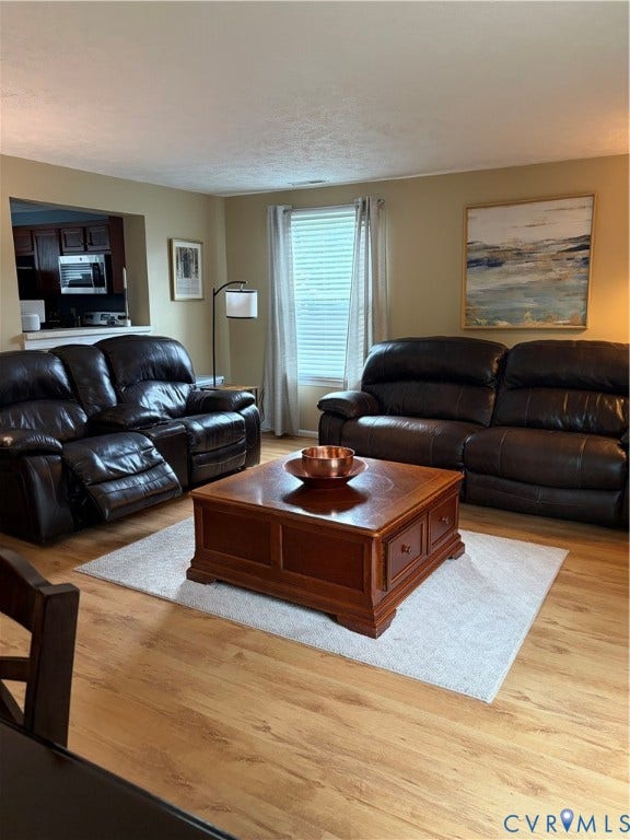4900 Finnegan Court, Henrico, VA 23228 Wood-finish flooring throughout, featuring a pass-through opening to the kitchen