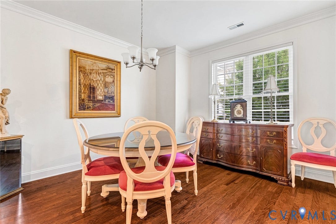 14379 Michaux Village Drive, Winterfield Park, Midlothian, VA 23113 Dining area featuring wood-finish flooring, crown molding, a multi-pane window with white blinds, and a brushed nickel chandelier