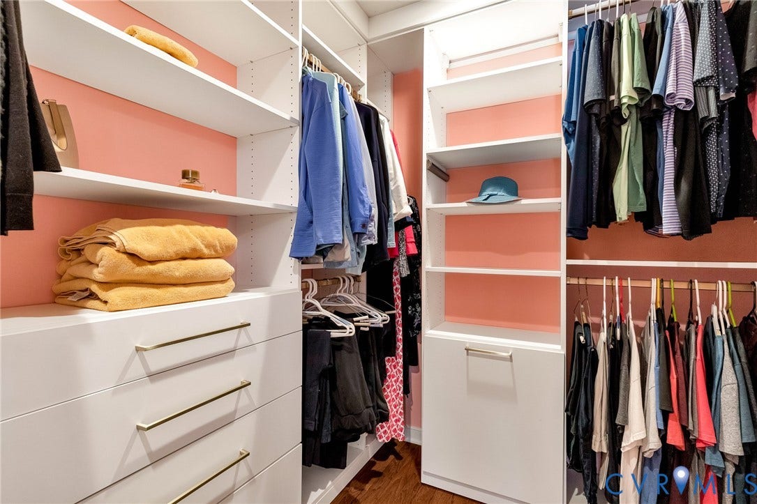 14379 Michaux Village Drive, Winterfield Park, Midlothian, VA 23113 Built-in custom closet system featuring white shelving, integrated drawers with gold-tone pulls, and ample hanging space