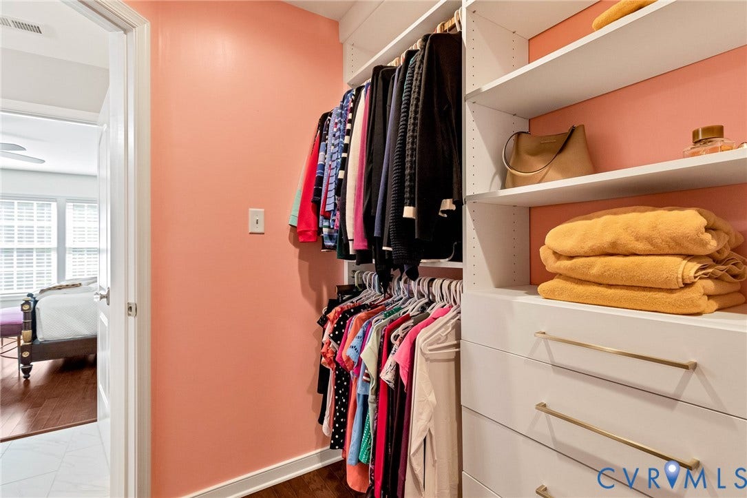14379 Michaux Village Drive, Winterfield Park, Midlothian, VA 23113 Custom closet system featuring built-in shelving, hanging rods, and integrated drawers with brass hardware
