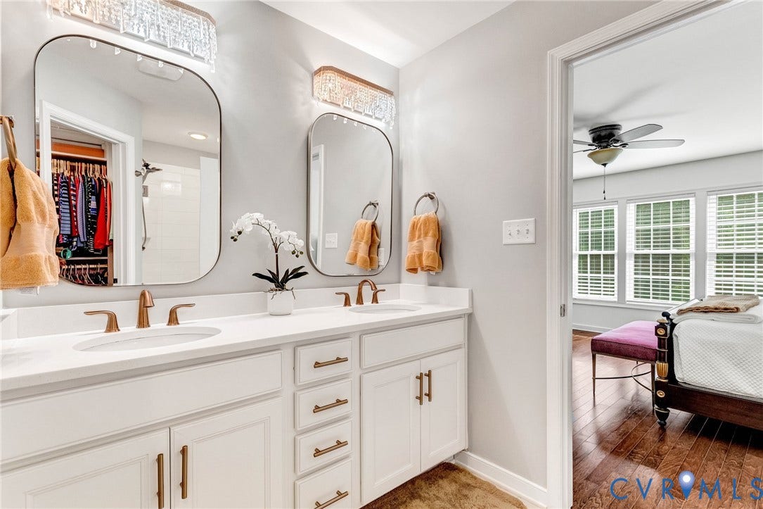 14379 Michaux Village Drive, Winterfield Park, Midlothian, VA 23113 Double vanity featuring white cabinetry, bronze hardware, and undermount sinks