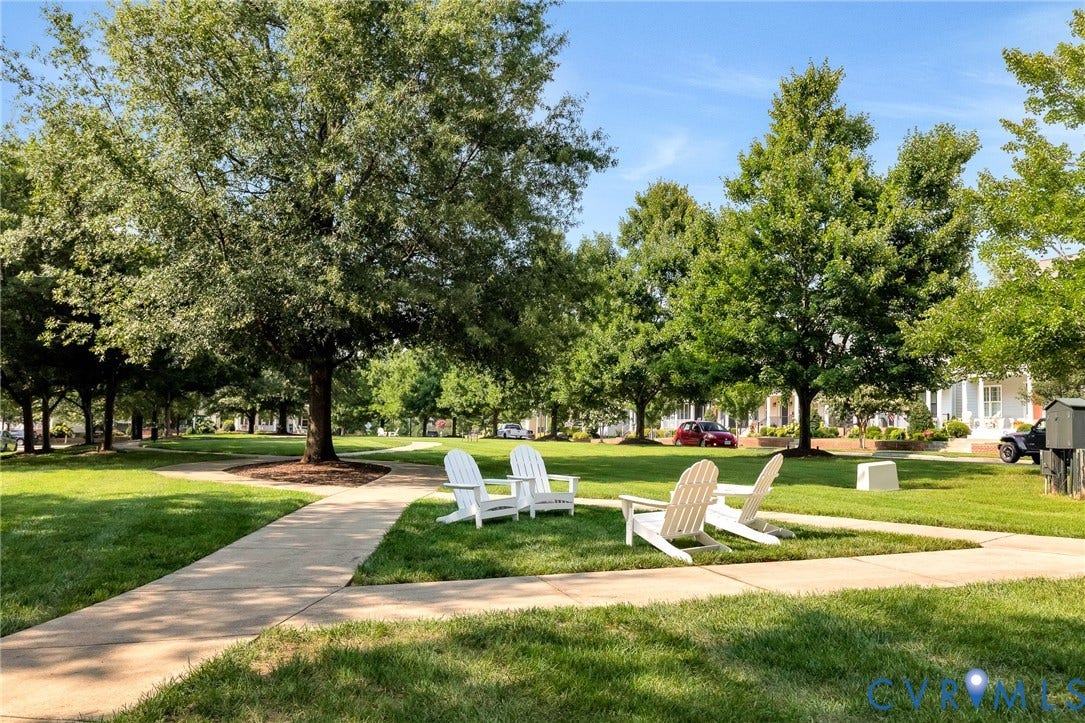 14379 Michaux Village Drive, Winterfield Park, Midlothian, VA 23113 Expansive green space featuring mature trees, manicured lawns, and paved walking paths