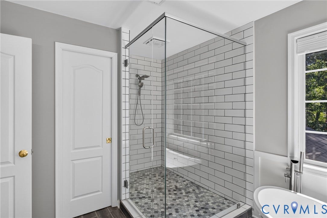 381 Shorewood Drive, Shorewood, Mineral, VA 23117 Glass-enclosed shower featuring subway tile surround, mosaic floor tile, and a multi-function showerhead