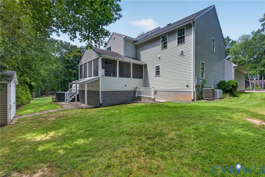 381 Shorewood Drive, Shorewood, Mineral, VA 23117 Rear exterior featuring light-colored siding, a screened porch, and a raised deck with white railings