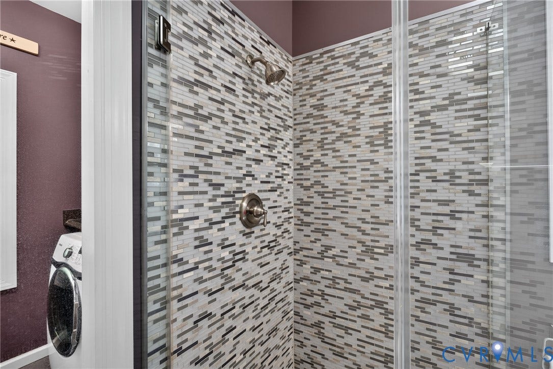 381 Shorewood Drive, Shorewood, Mineral, VA 23117 Shower enclosure featuring glass doors and mosaic tile surround