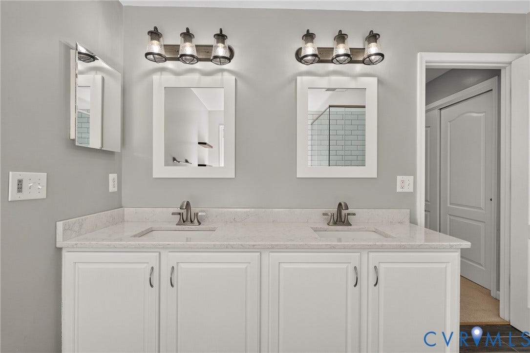 381 Shorewood Drive, Shorewood, Mineral, VA 23117 Double vanity with white cabinetry and light-toned countertops