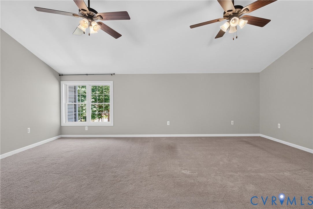 381 Shorewood Drive, Shorewood, Mineral, VA 23117 Spacious room featuring neutral carpeting, light gray walls, and white trim