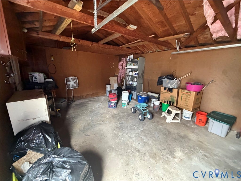 2206 Lancers Boulevard, Richmond, VA 23224 Exposed wood rafter ceiling and concrete flooring