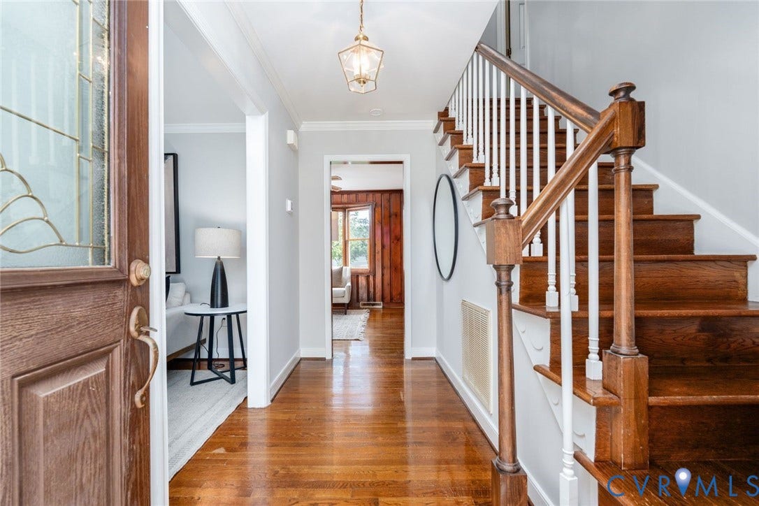 14613 Gimbel Drive, Chester, VA 23836 Entryway featuring wood-finish flooring, a turned wood staircase with white balusters, and a decorative glass front door