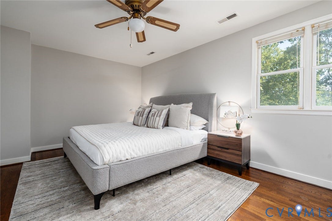 14613 Gimbel Drive, Chester, VA 23836 Hardwood flooring, light-toned wall paint, white trim, ceiling fan with light fixture, and window with natural light