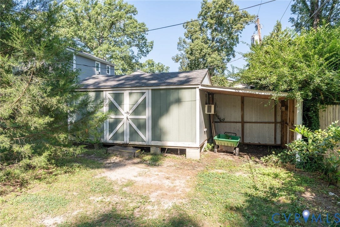 14613 Gimbel Drive, Chester, VA 23836 Storage shed with double doors and an attached covered lean-to area