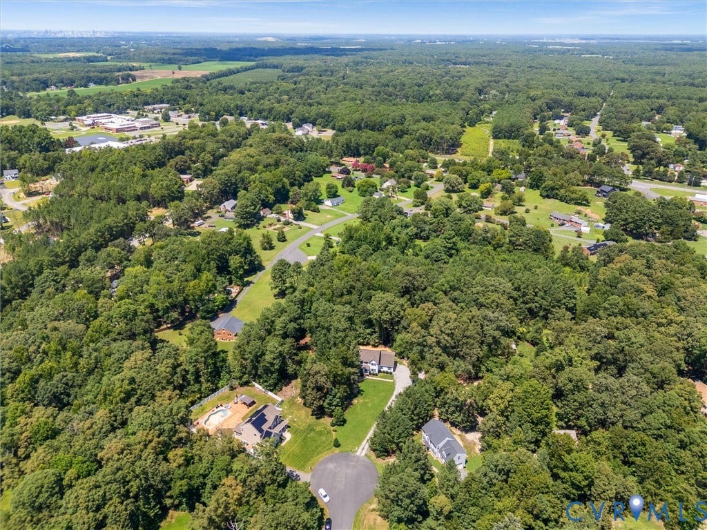 8200 Madeline Court, Strath Woods, Henrico, VA 23231 Expansive aerial perspective showcasing a residential area surrounded by abundant mature trees and verdant landscapes