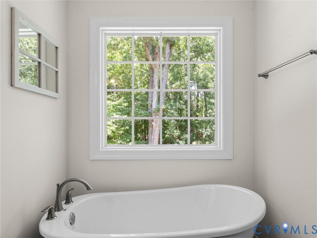 8200 Madeline Court, Strath Woods, Henrico, VA 23231 Freestanding soaking tub with brushed nickel fixtures and a divided light window