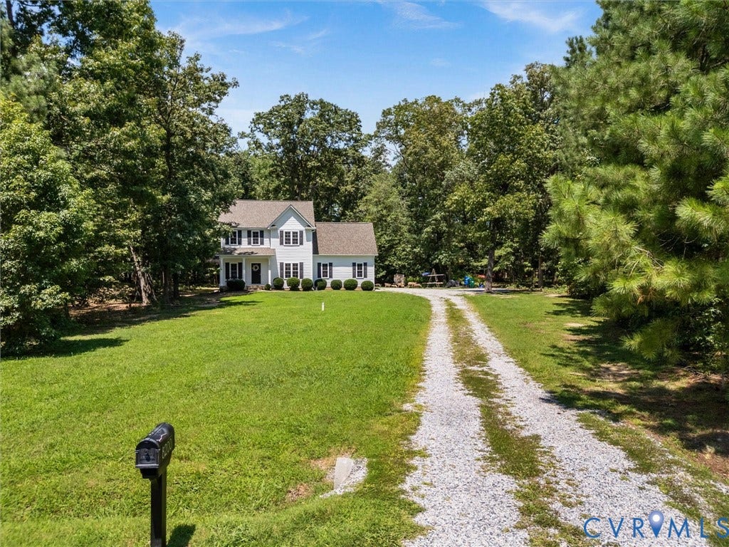 8200 Madeline Court, Strath Woods, Henrico, VA 23231 White two-story home with dark shutters and a shingle roof
