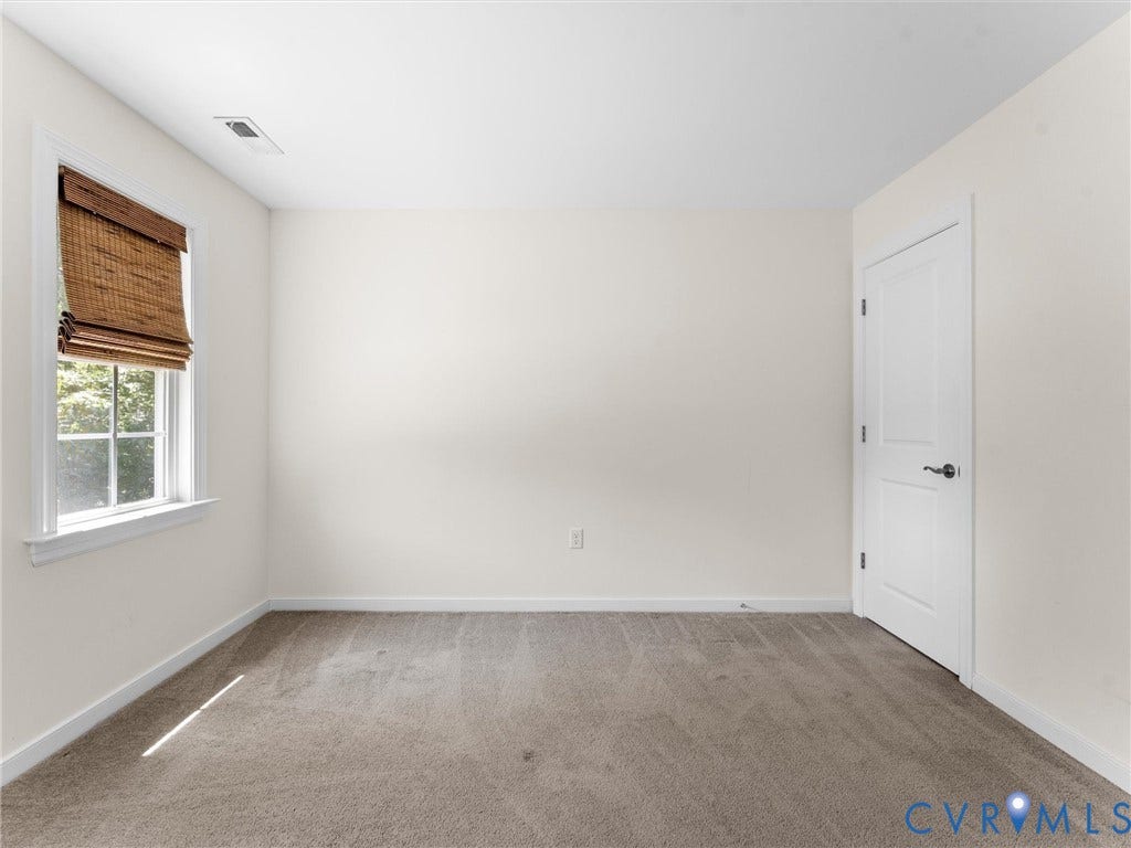 8200 Madeline Court, Strath Woods, Henrico, VA 23231 Neutral wall tones and plush carpet create a versatile interior space