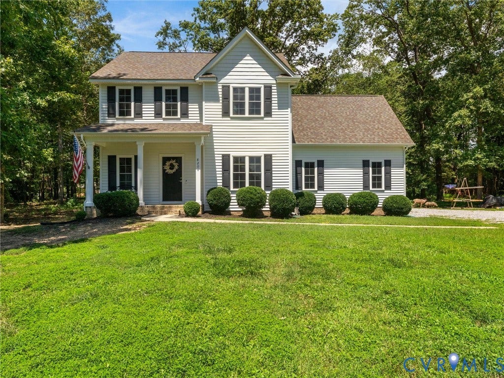 8200 Madeline Court, Strath Woods, Henrico, VA 23231 Two-story residence featuring light-colored siding, dark shutters, and a covered porch with white columns