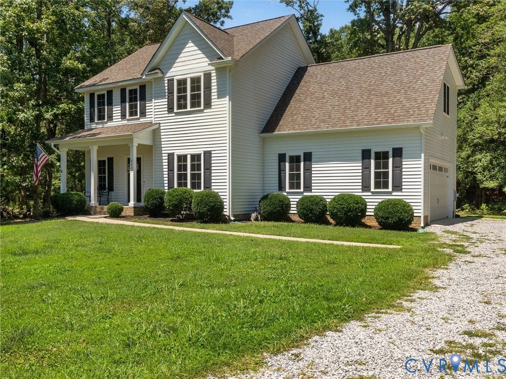 8200 Madeline Court, Strath Woods, Henrico, VA 23231 Two-story white siding residence featuring a covered front porch with white columns, dark shutters, and a gravel driveway