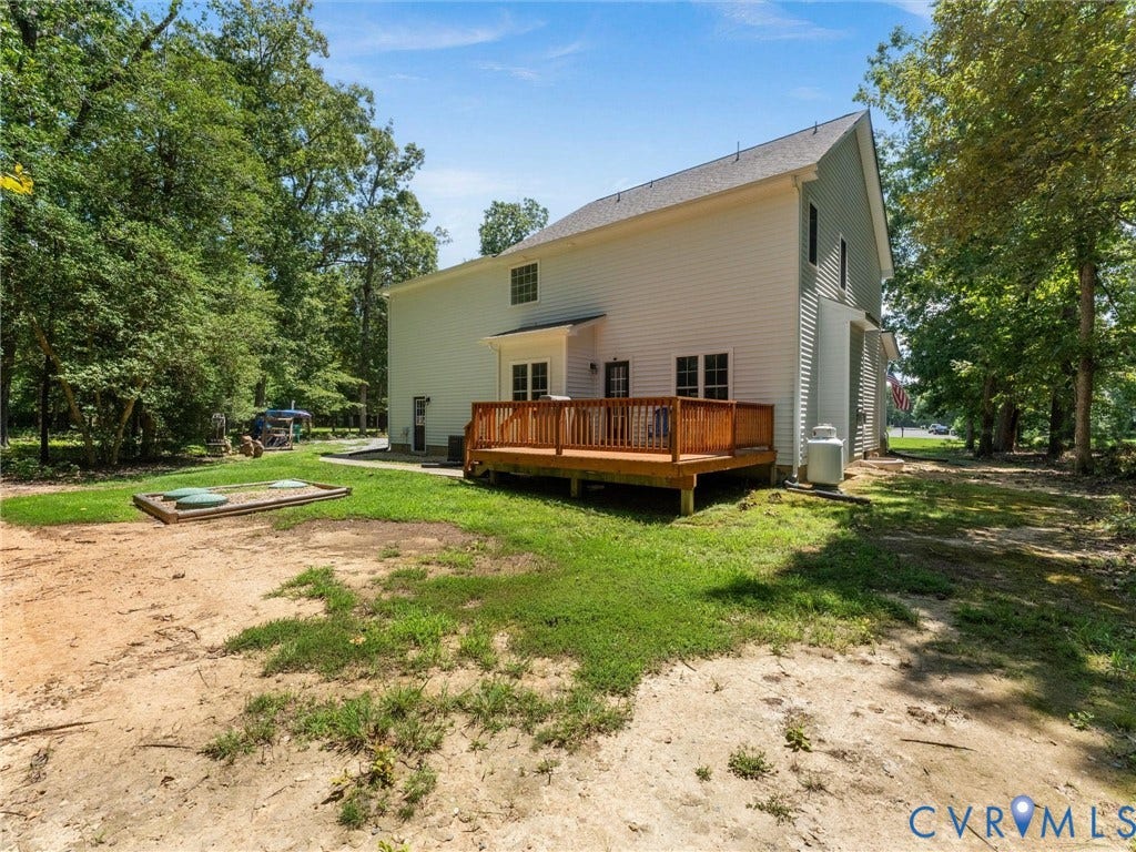 8200 Madeline Court, Strath Woods, Henrico, VA 23231 Rear exterior with a wood deck, light-colored siding, and a gabled roofline
