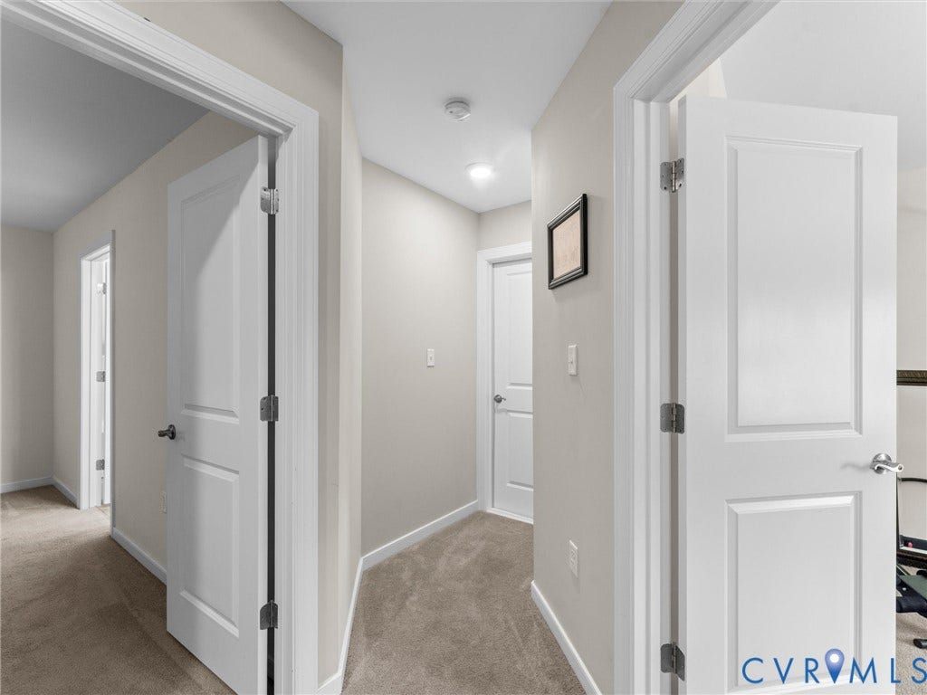 8200 Madeline Court, Strath Woods, Henrico, VA 23231 Neutral painted hallway with plush carpet flooring, recessed lighting, and white panel doors