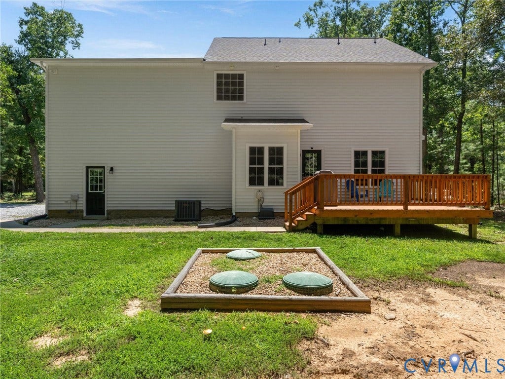 8200 Madeline Court, Strath Woods, Henrico, VA 23231 Spacious rear deck crafted from wood, offering exterior access