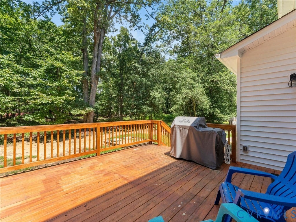 8200 Madeline Court, Strath Woods, Henrico, VA 23231 Spacious wood-finish deck with a natural wood railing