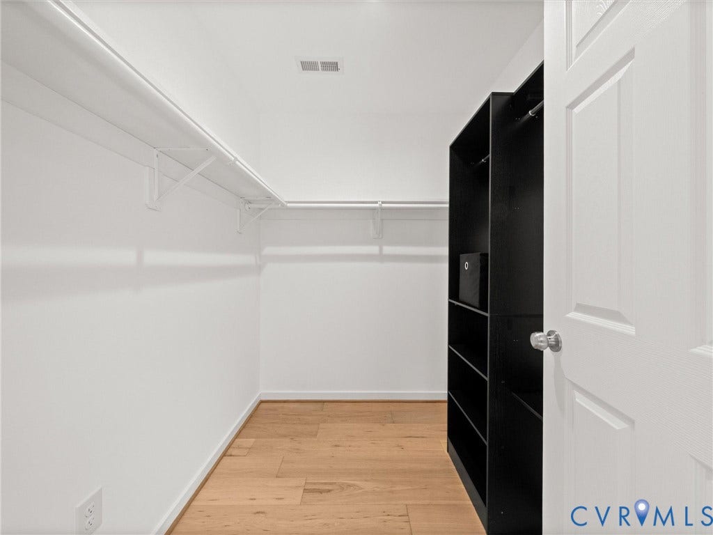 2224 Highland Drive, Powhatan, VA 23139 Walk-in closet featuring wood-finish flooring, built-in shelving, and white walls