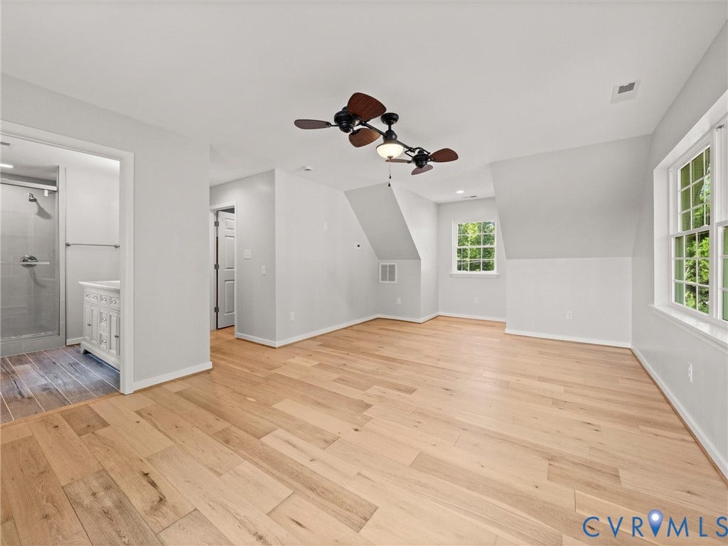 2224 Highland Drive, Powhatan, VA 23139 Hardwood flooring, multiple windows, ceiling fans, recessed lighting, and an attached bathroom with a shower