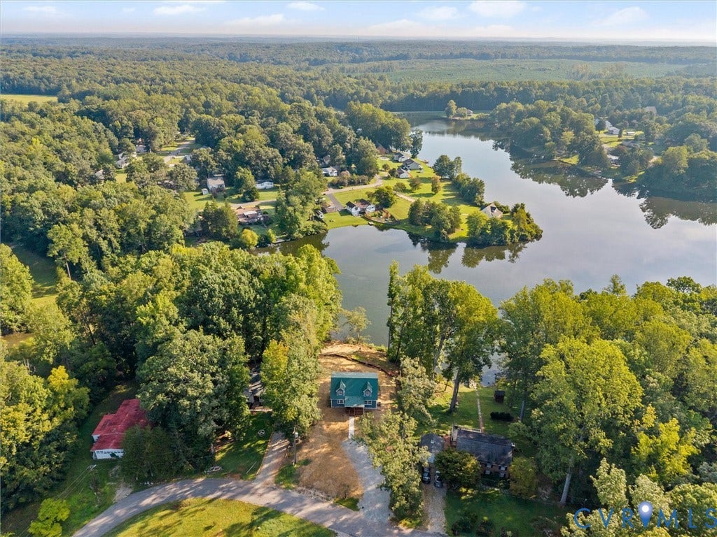 2224 Highland Drive, Powhatan, VA 23139 Expansive wooded landscape with a prominent lake and surrounding properties