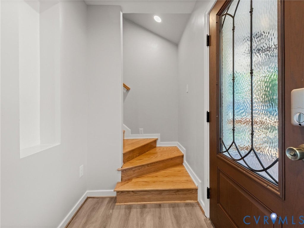 2224 Highland Drive, Powhatan, VA 23139 Wood-finish flooring, hardwood staircase, recessed lighting, and a leaded glass entry door