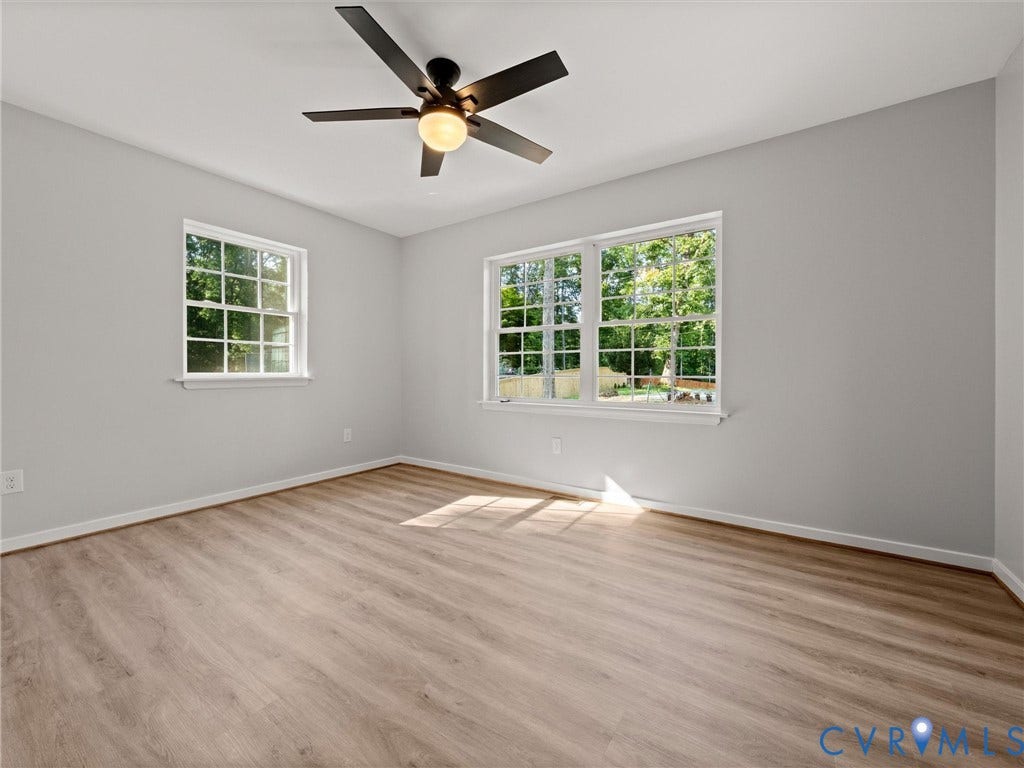 2224 Highland Drive, Powhatan, VA 23139 Light wood-finish flooring, white trim, and a ceiling fan with integrated lighting