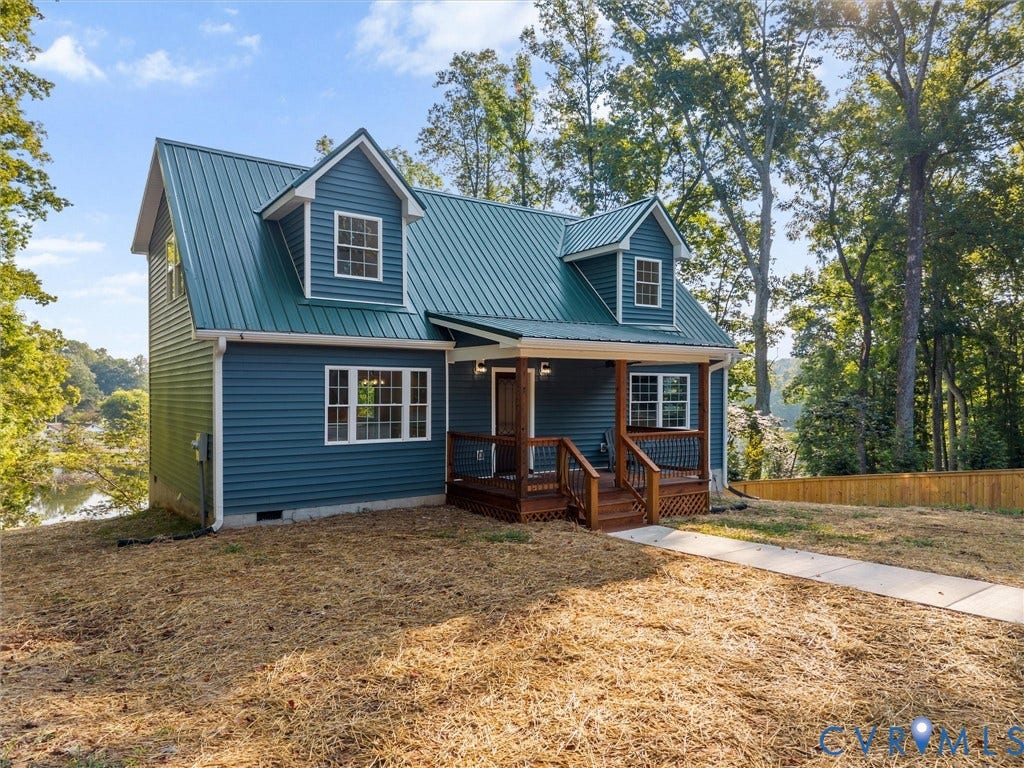 2224 Highland Drive, Powhatan, VA 23139 Blue siding with a green metal roof and white trim