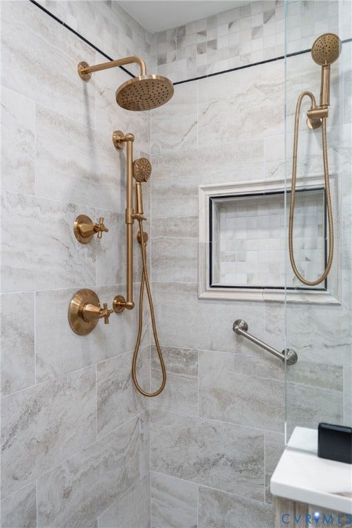 1719 Logwood Circle, Henrico, VA 23238 Primary shower: Tile with rain shower head, handheld shower, recessed niche, and bench
