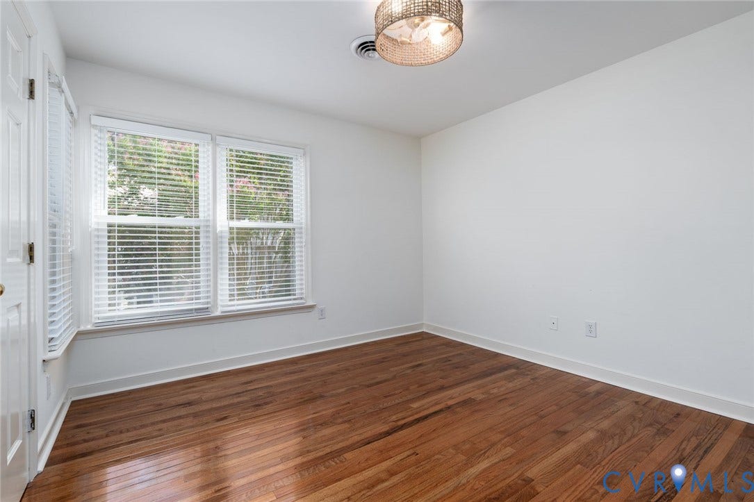 1719 Logwood Circle, Henrico, VA 23238 Bedroom #2: Bright, light-filled, showcasing refinished hardwood flooring, large double-hung windows with custom blinds and a closet with custom shelving