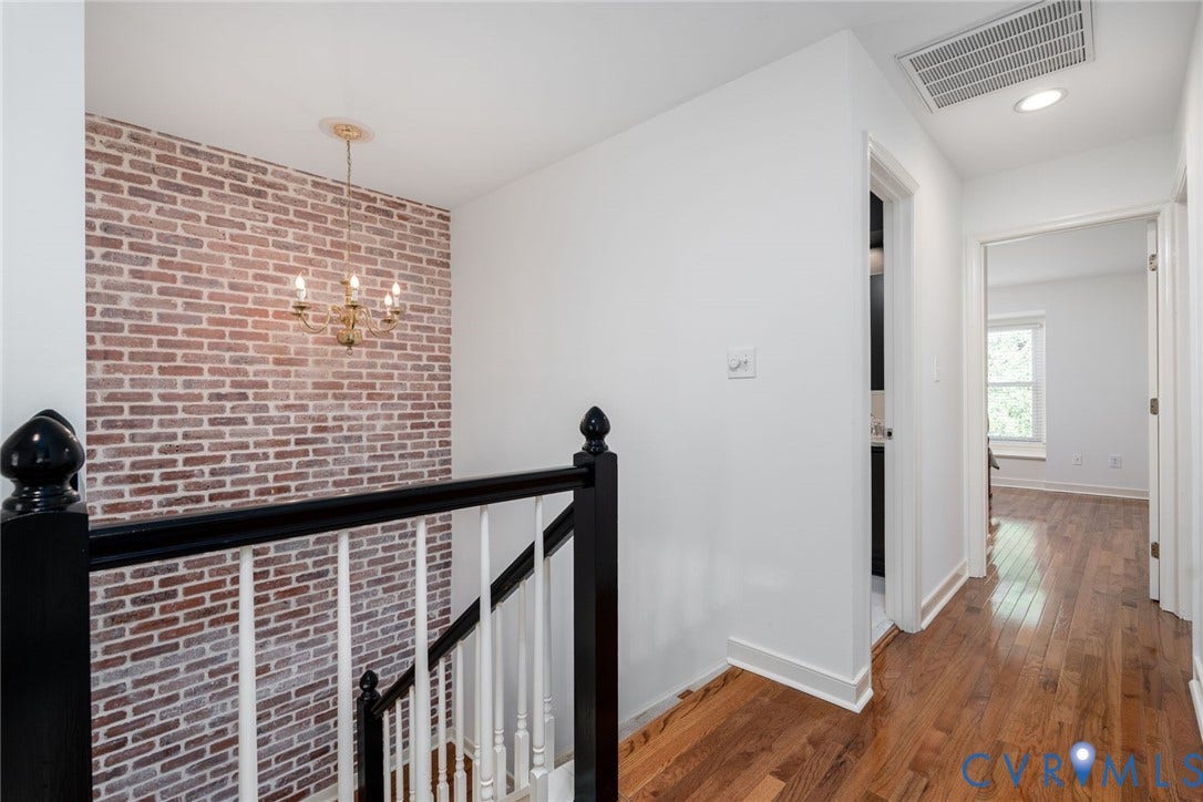 1719 Logwood Circle, Henrico, VA 23238 Staircase: Exposed brick wall accent, overhead chandelier, recessed lighting, wood-finish flooring
