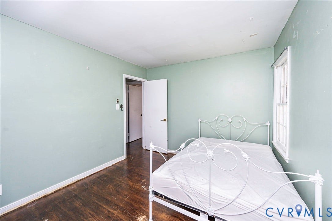 124 Northfield Lane, North Chesterfield, VA 23236 Wood-finish flooring with light-colored walls and a window