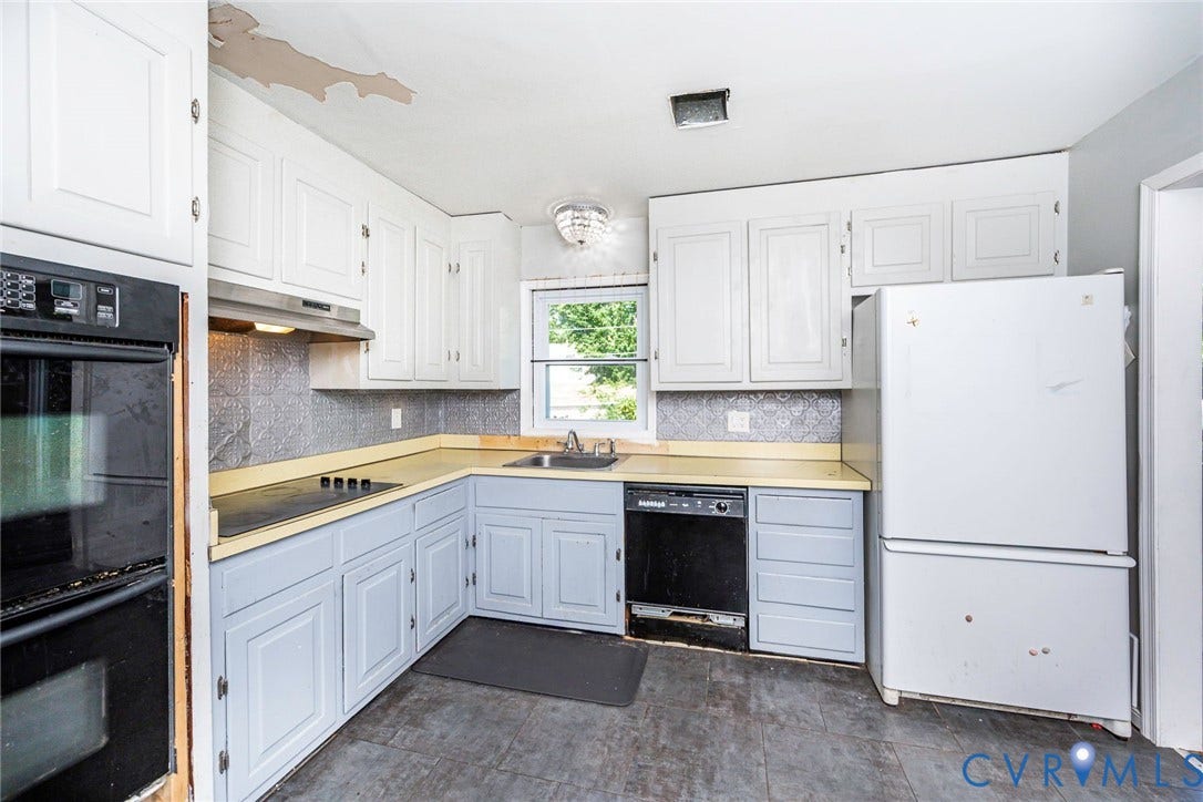 124 Northfield Lane, North Chesterfield, VA 23236 Built-in wall oven, electric cooktop, stainless steel range hood, ample cabinetry, and window over the sink