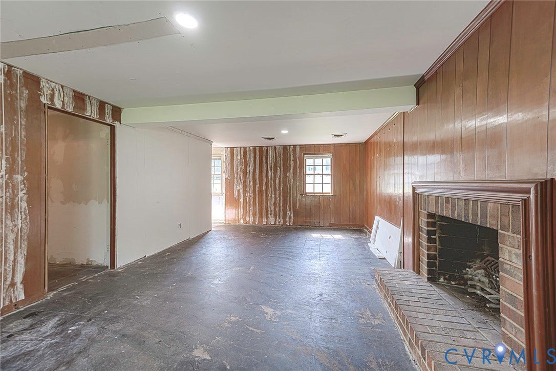 124 Northfield Lane, North Chesterfield, VA 23236 Brick fireplace with a wood mantel