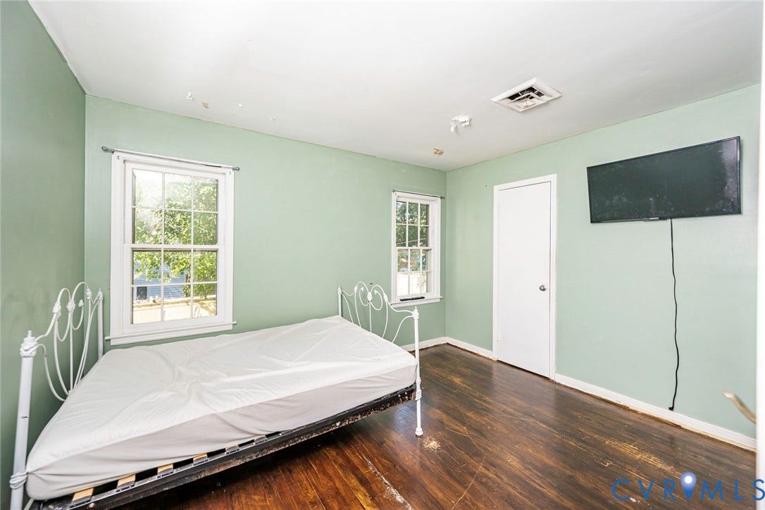 124 Northfield Lane, North Chesterfield, VA 23236 Wood-finish flooring, two windows, painted walls, and a white door