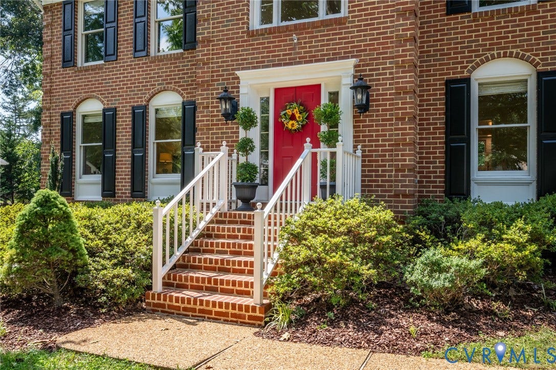 3704 Milbrier Place, Henrico, VA 23233 Brick exterior featuring black louvered shutters and arched windows
