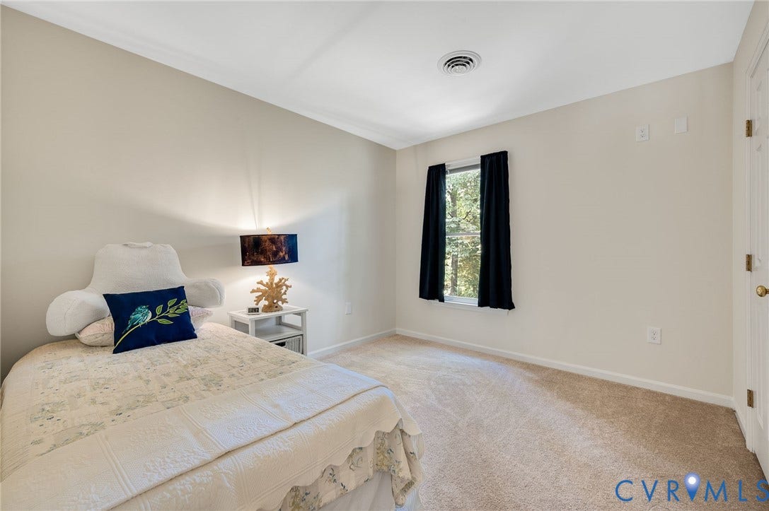 3704 Milbrier Place, Henrico, VA 23233 Carpeted flooring, neutral wall tones, crown molding, and a window with black privacy drapes