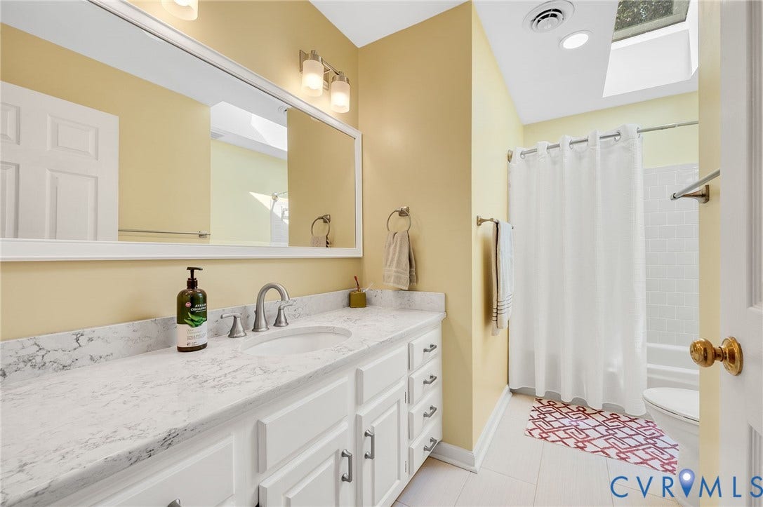 3704 Milbrier Place, Henrico, VA 23233 Built-in vanity with white cabinetry, a single sink, and a light-toned countertop